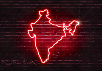Neon sign on a brick wall in the shape of India.(illustration series)
