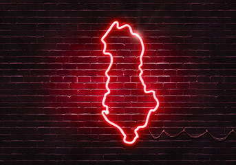 Neon sign on a brick wall in the shape of Albania.(illustration series)