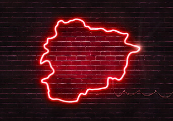 Neon sign on a brick wall in the shape of Andorra.(illustration series)