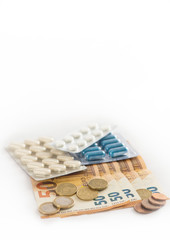 Inaccessible medicines, euro lie with pills on a white background