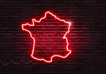 Neon sign on a brick wall in the shape of France.(illustration series)