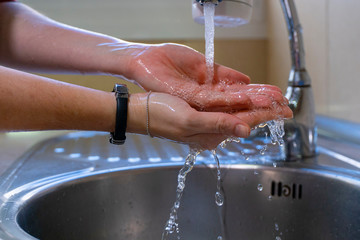 Washing hands properly. Hygiene concept. Splashing water.
