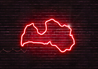 Neon sign on a brick wall in the shape of Latvia.(illustration series)