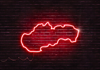 Neon sign on a brick wall in the shape of Slovakia.(illustration series)