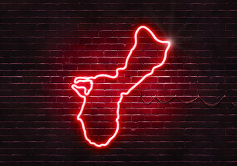 Neon sign on a brick wall in the shape of Guam.(illustration series)