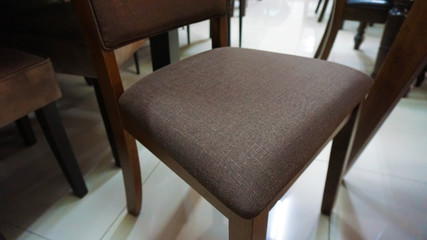 Dining chairs and tables in a Furniture Showroom. Texture of Chairs and table dining set of a cafe or restaurant.