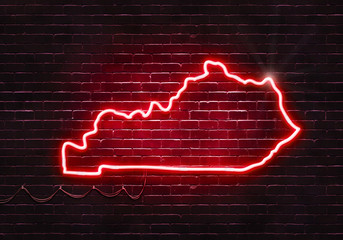 Neon sign on a brick wall in the shape of Kentucky.(illustration series)