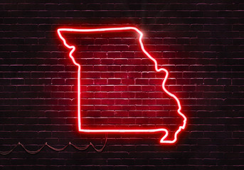 Neon sign on a brick wall in the shape of Missouri.(illustration series)