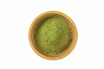 Matcha green tea powder in wooden bowl isolated on white background. top view