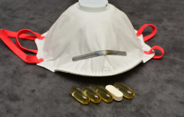 Fish oil capsules with omega 3 and vitamin D, calcium and magnesium caplet, protective mask,...