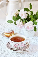 Fototapeta na wymiar A tea party in the style of Shabby Chic. tea in the beautiful tea steam with a pattern 