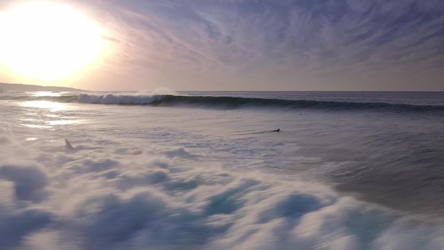 Flying over the Waves of the Ocean to the Sun and the sea Aerial view 4K Wave Splashing Rocky Coast Sea Canary Islands Beach 