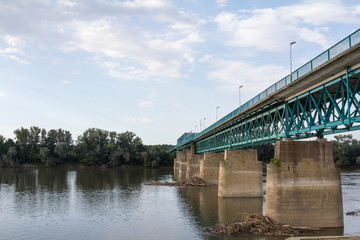 Fototapeta na wymiar Steel bridge crossing the Sava river between Brcko and Gunja, at the border between Bosnia and Herzegovina and Croatia, an official border crossing of the European Union (EU)