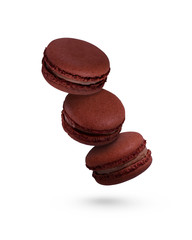 Chocolate macaroons isolated on a white background, fly