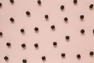 Cacao chocolate balls pattern on pink background. Flat lay, top view