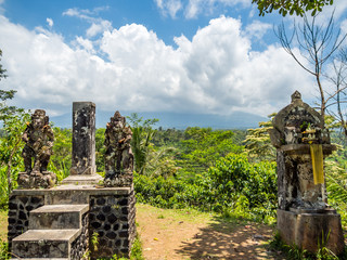 Mount Agung shrouded in cloud with rice fields in the foreground, Bali