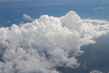 Dramatic cloudscape during sunset from the airplane's window