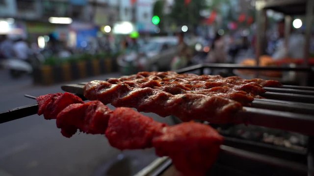 Kebabs cooked with skewers on the street of Mumbai India in the evening