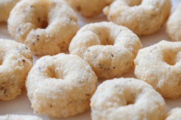 Thai Traditional Style Donut (Kanom Wong), homemade cooking deep fried in round shape tastes sweet and salty. Thai dessert