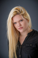 Naklejka premium Blond Girl wearing Black Clothing