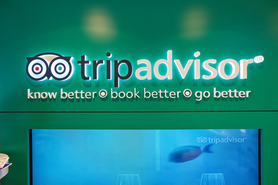 HONG KONG, CHINA - CIRCA APRIL, 2019: close up shot of TripAdvisor sign in a store at Hong Kong International Airport.