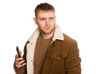 Young handsome man talking on a smartphone