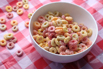 Colorful cereal on a table cloths, top view .