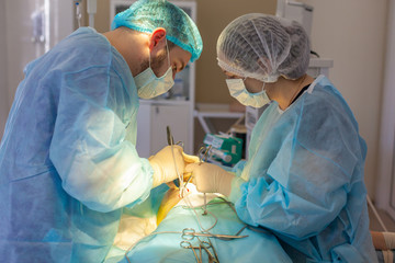 Hospital. Surgeon operates in the operating room. Surgeons perform a complex operation saving lives...