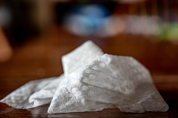 crumpled sanitizing wipe used to disinfect