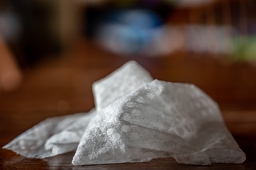 crumpled sanitizing wipe used to disinfect