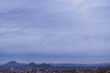 sunrise city buildings mountains