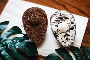 Delicious chocolate Easter eggs on wooden background