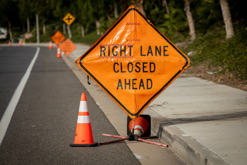 Right Lane Closed Ahead sign with signs in distance
