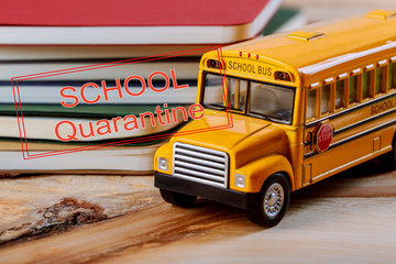SCHOOL Quarantine global pandemic corona virus covid-19 colored pen and copybook, toy yellow school bus