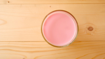 Pink Milk on wooden table