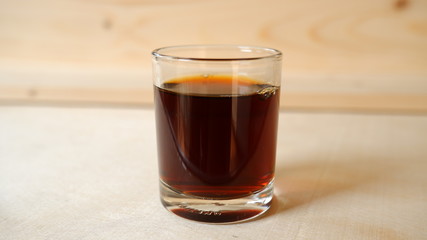 Espresso Coffee shot with wooden background