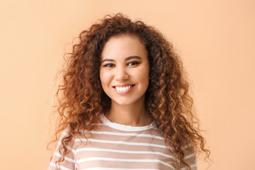 Happy woman with healthy teeth on color background