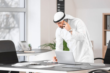 Arab businessman working in office