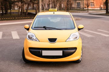 Fototapeta na wymiar Modern taxi car on city road