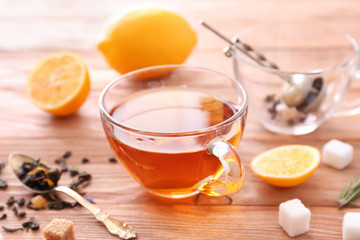 Cup of hot tea on table