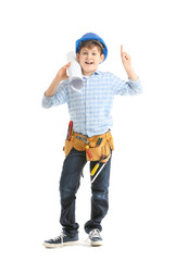 Cute little builder with raised index finger on white background