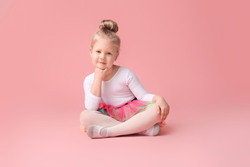 Cute little ballerina on color background © Pixel-Shot