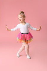 Cute little ballerina on color background © Pixel-Shot