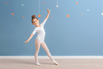 Cute little ballerina near color wall © Pixel-Shot