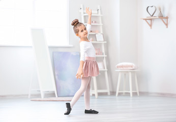 Fototapeta na wymiar Cute little ballerina at home