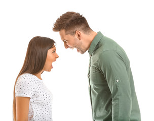 Young couple quarreling on white background