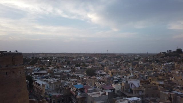 Low sun hyperlapse of an Indian city. The shot is taken from atop an old fort which gives a beautiful view of the sprawl below.