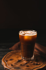 Glass of iced coffee on table