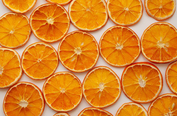 sliced and dried oranges on a white background