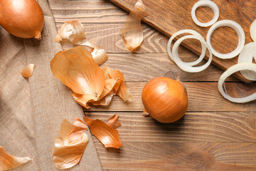 Fototapeta na wymiar Composition with fresh raw onion on wooden table